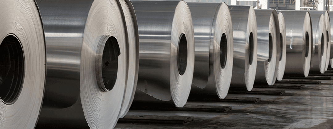 row of steel rolls in factory